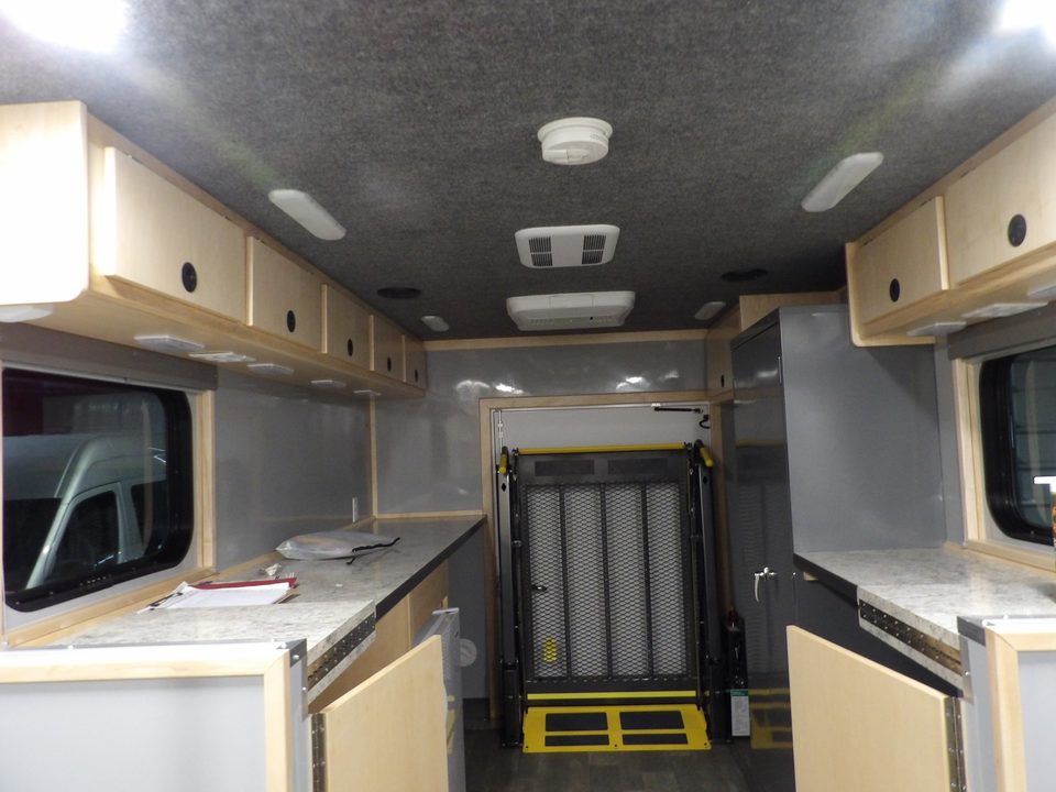 Mobile DMV office interior: counters and cabinets