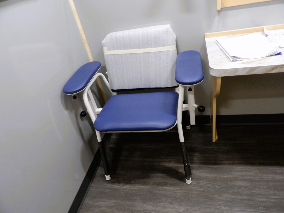 Blue phlebotomy chair and side counter