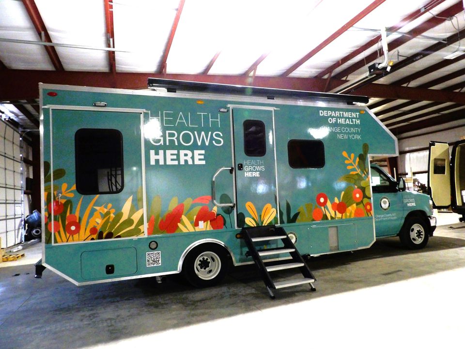 Mobile health unit, driver side, entry steps down, in the plant