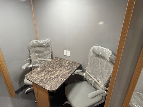 Mobile office interior: desk and two chairs