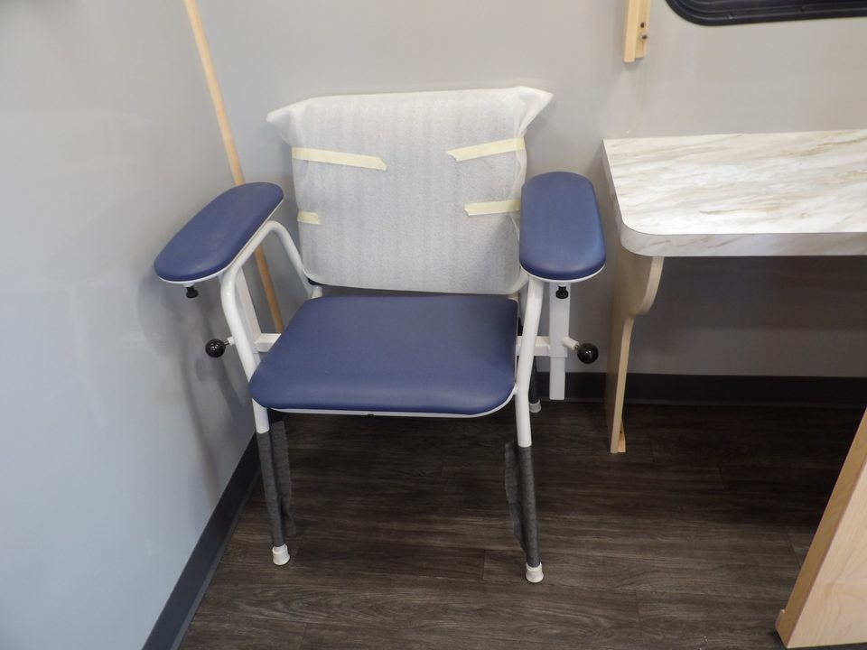 Mobile clinic patient chair and cabinets
