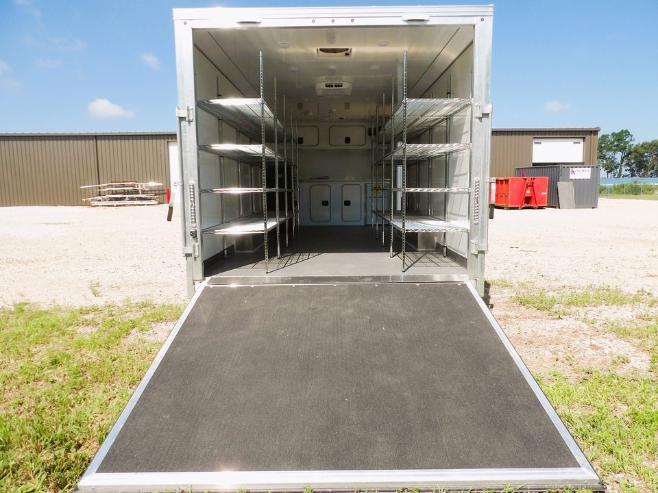 Rear ramp down showing wire shelving both sides