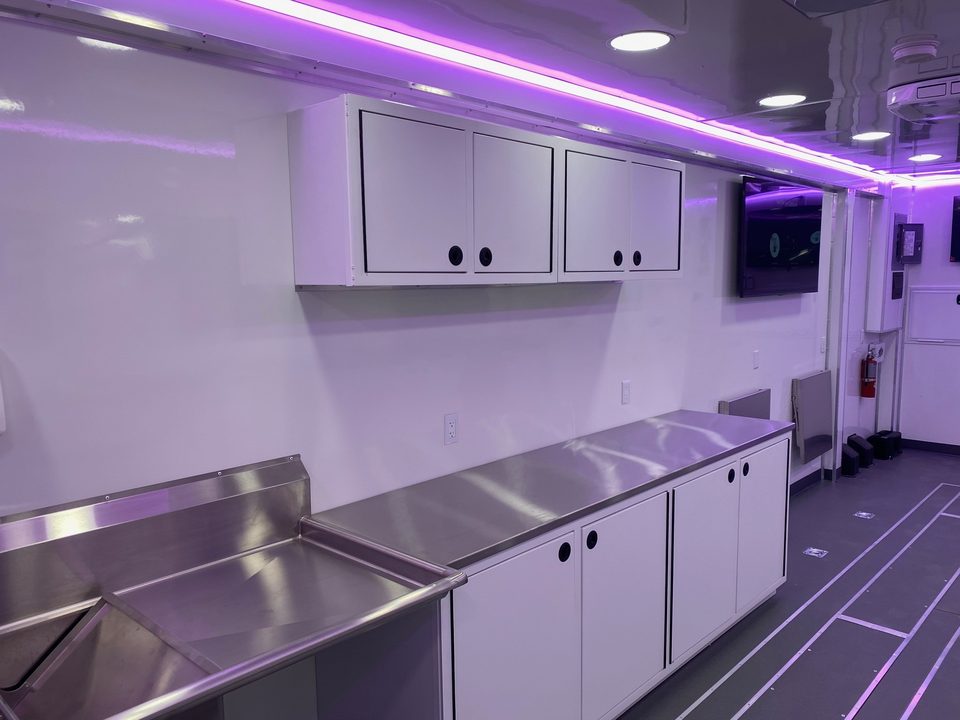 Lab trailer interior, sinks and overhead cabinets