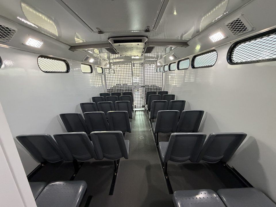 Prisoner transport interior looking forward down the aisle