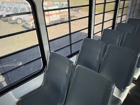 Prisoner transport molded seats and mesh partition