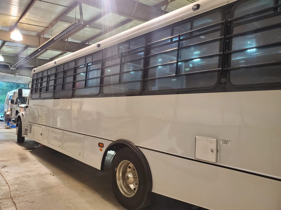 Prisoner transport vehicle, passenger side, barred windows