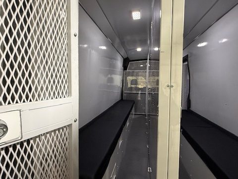Ford Transit prisoner transport interior: mesh compartments and bench seats