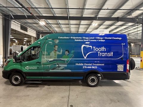 Mobile dental van, passenger side, Tooth Transit wrap