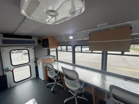 Workstation counter with task chairs along the windows