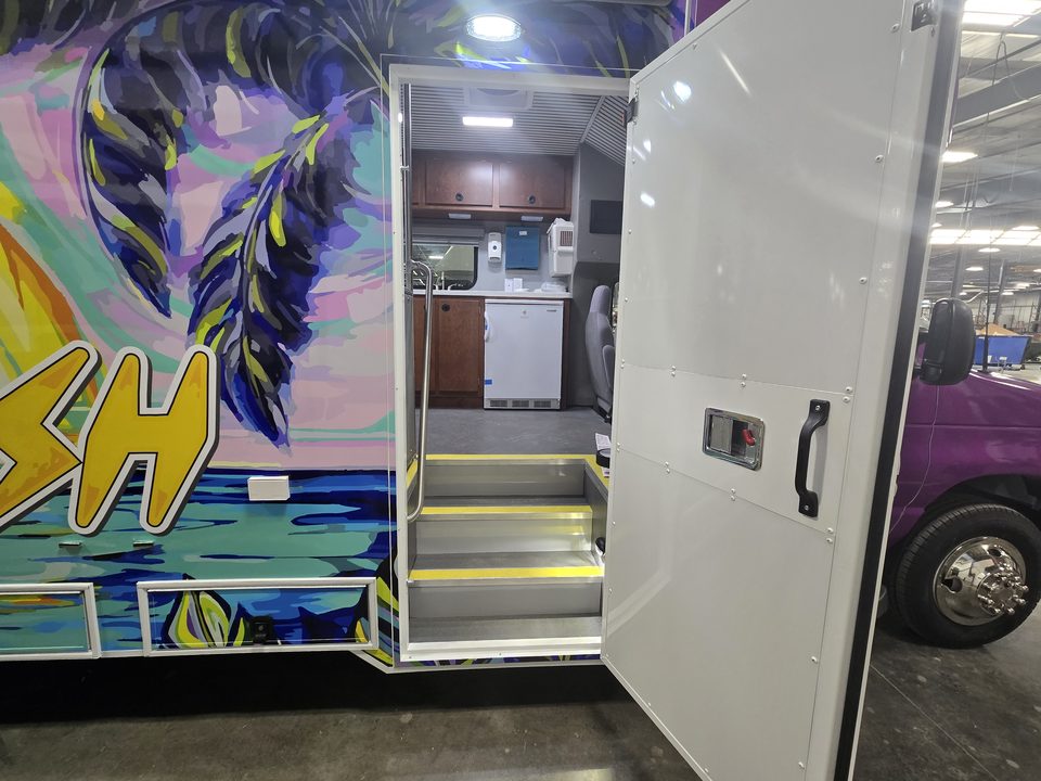 Mobile health unit entry door open with steps