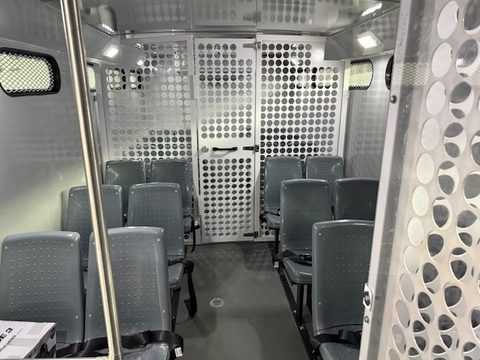 Interior: molded seats inside perforated-steel compartments
