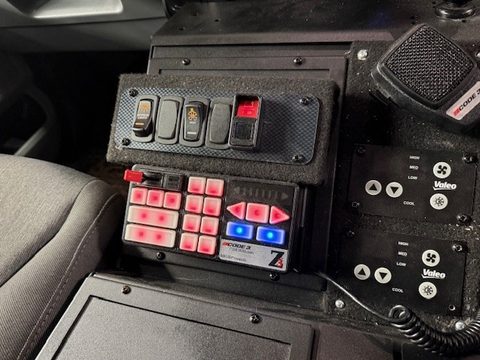Officer switch panels and radio in the cab