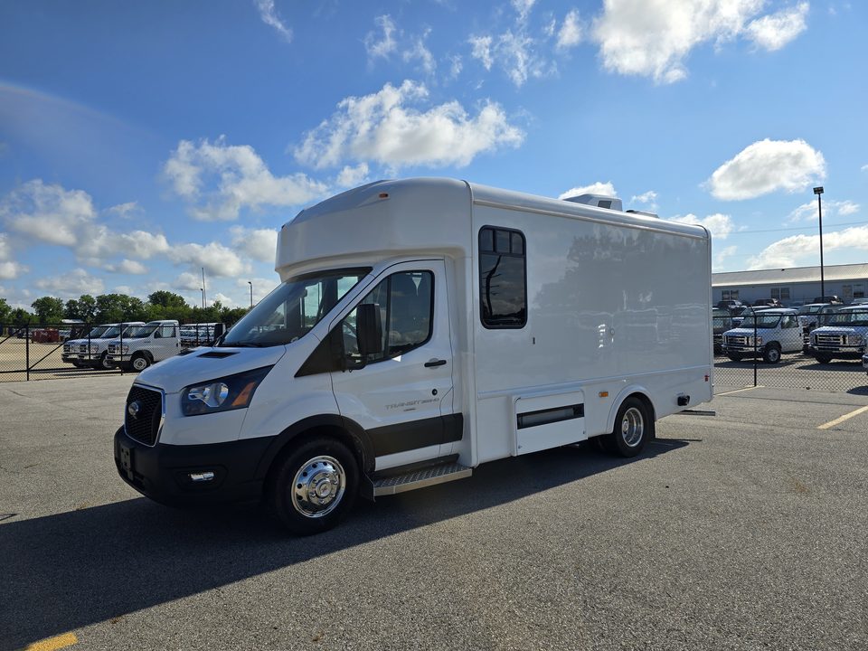 White mobile outreach unit on a Ford Transit cutaway, front three-quarter, outside
