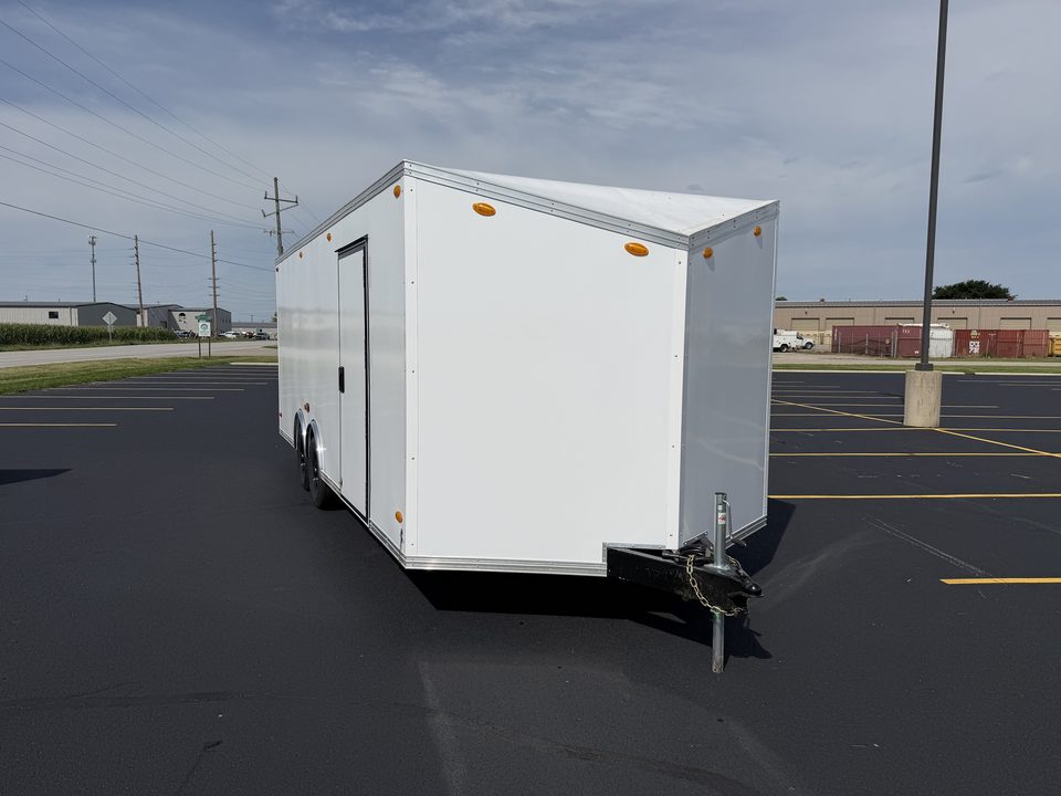 White enclosed bumper-pull trailer outside the HLE plant