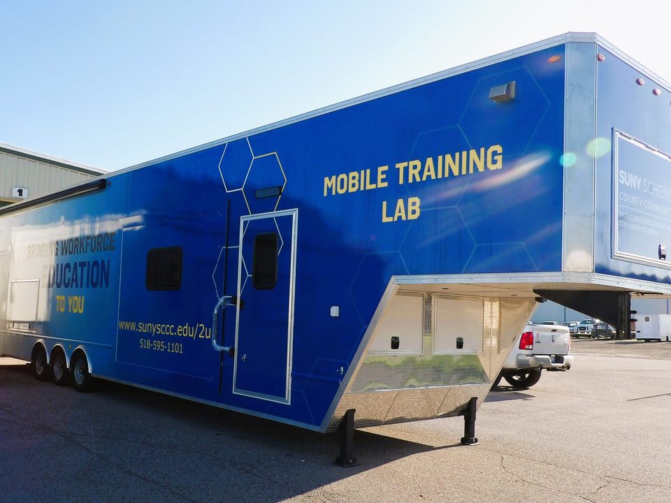 Mobile training lab on a gooseneck trailer, wrapped, at the HLE plant