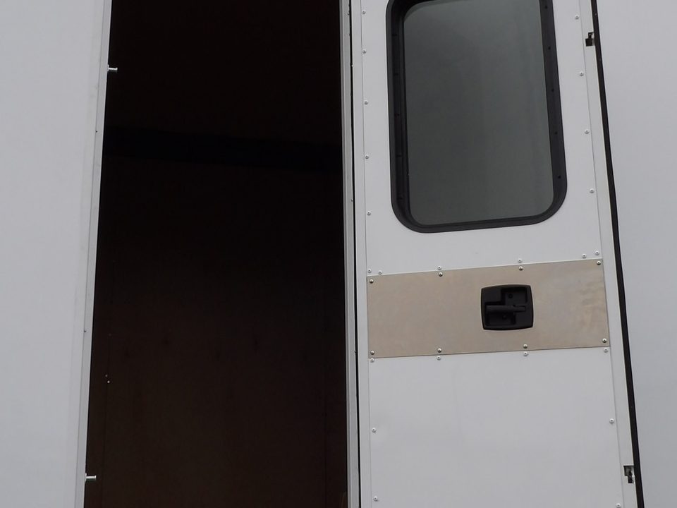 Patient entry door open on the mammography unit body