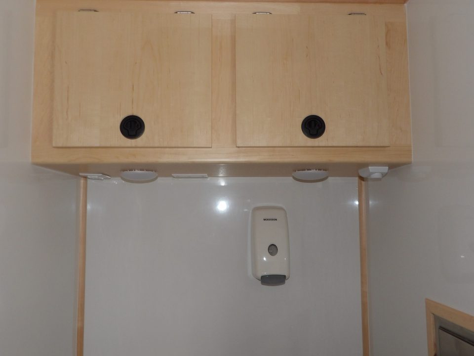 Overhead cabinets and counter inside the mobile medical unit