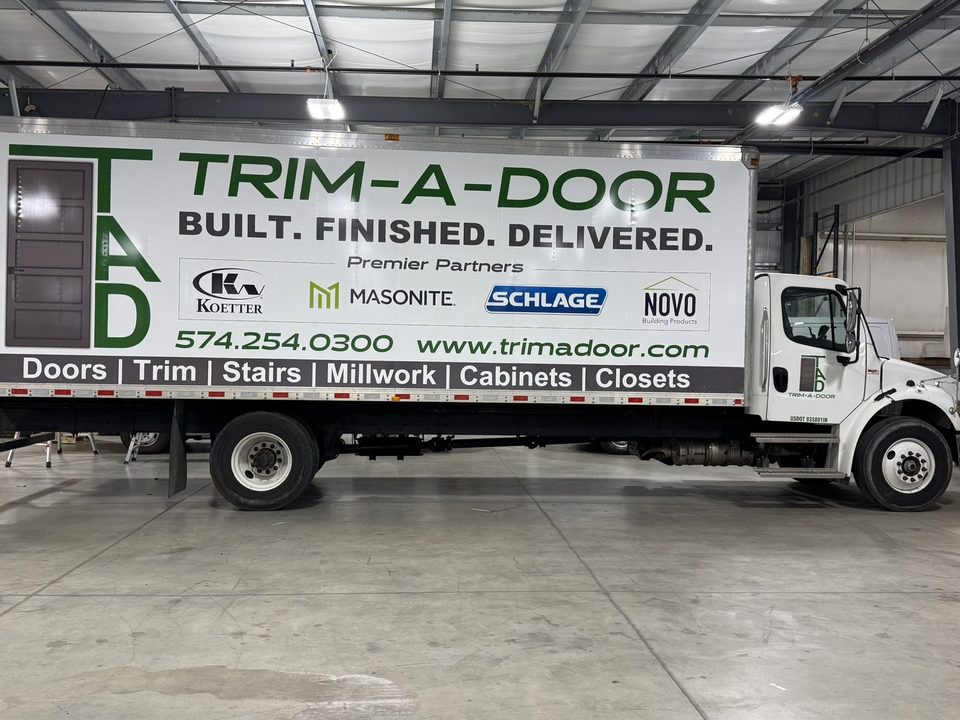 Box truck with a full lettering wrap for a door and millwork supplier, in the wrap shop