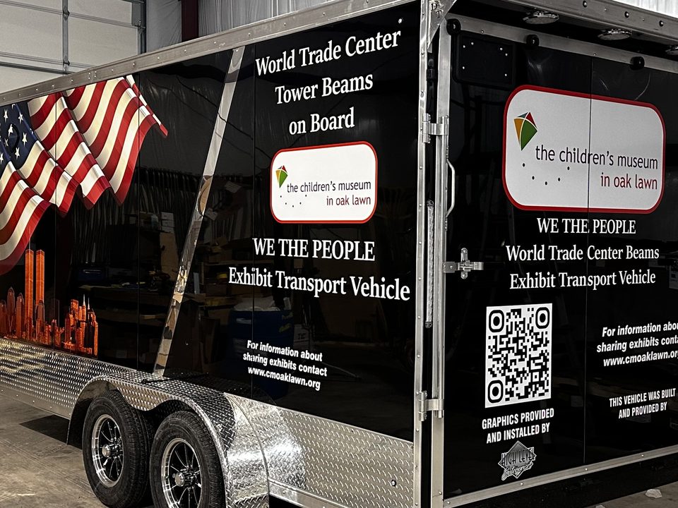 Exhibit trailer rear doors wrapped with the museum graphics