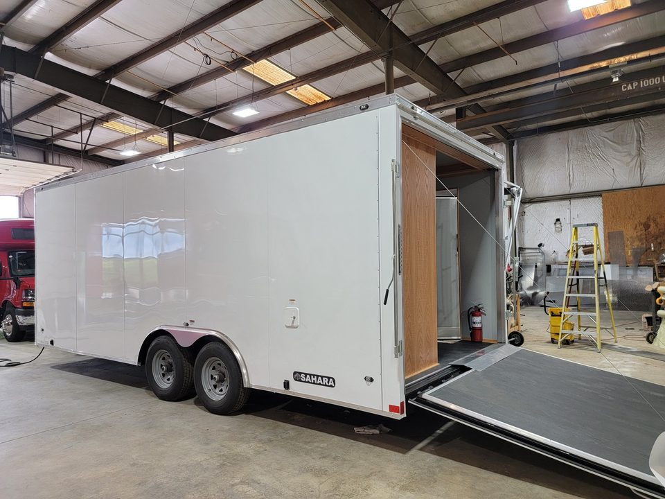 Trailer rear ramp door down, in the plant